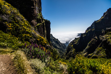 Colorful mountain ridge path with volcanic formations beside, Pico do Arieiro, Madeira, Portugal