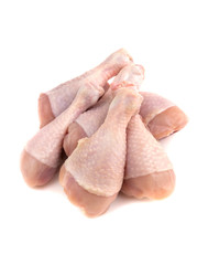 Several chicken legs close-up. Raw chicken legs isolated on white background.