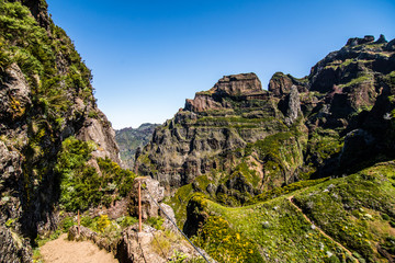 Colorful mountain ridge path with volcanic formations beside, Pico do Arieiro, Madeira, Portugal