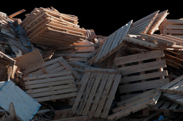 Pile of broken wood on a black background