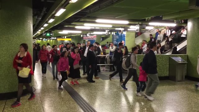 Hong Kong November 24th 2016: Timelapse of Hong Kong Mass Transit Railways commuters taking escalators at Kennedy Town Mass Transit Railway, Hong Kong