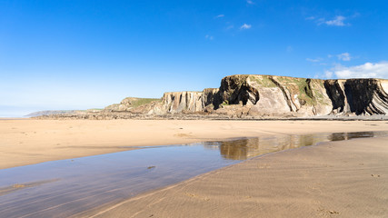 Cornwall Bude Beach with a stream running through 