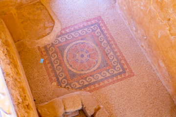 ancient destroyed mosaics on the floor