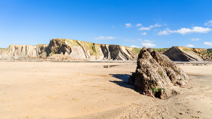 Cornwall Bude Beach with cliffs in the background