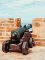Fototapeta na wymiar Brass Canon on the city wall of Essaouira, Morocco