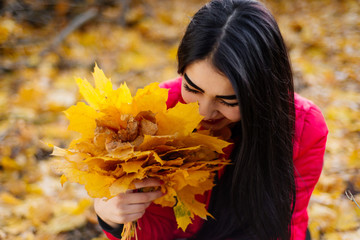 Woman with autumn leaves 