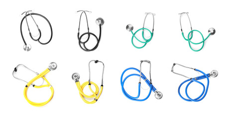 Set with stethoscopes on white background. Medical objects