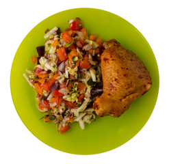 chicken wing with vegetable salad on a plate. chicken wing with vegetable salad isolated on white...