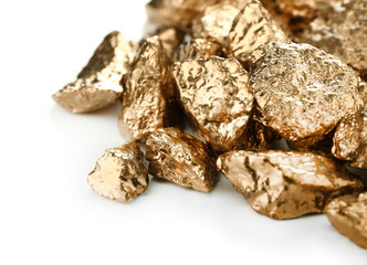Gold nuggets on white background
