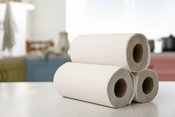 Rolls of paper towels on kitchen table
