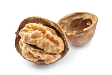 Cracked walnut on white background