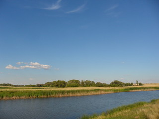 landscape with river and blue sky