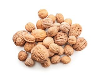 Unpeeled walnuts on white background
