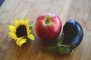 Fresh picked Apples, Eggplant, and Sunflower shot in Puerto Rico. Organic farming, fresh farmers market fall harvest. Delicious organic food. 