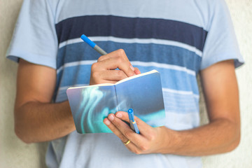 Boy Writing Notebook