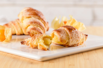 Small croissant with physalis fruits