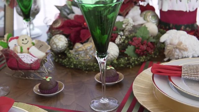 close up shot from left to right of a beautiful christmas dinner table modern decoration