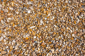 Rocks and Stone beach pattern closeup, Summer seacoast background