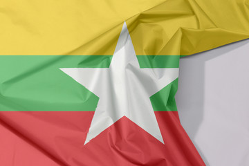 Myanmar fabric flag crepe and crease with white space, red green and yellow color and white star.