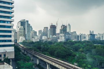 Fototapeta premium Building in the city with Electric Railway Train in Bangkok Thailand