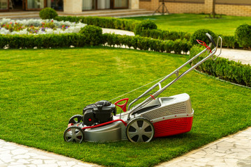 lawn mower with grass container in the yard
