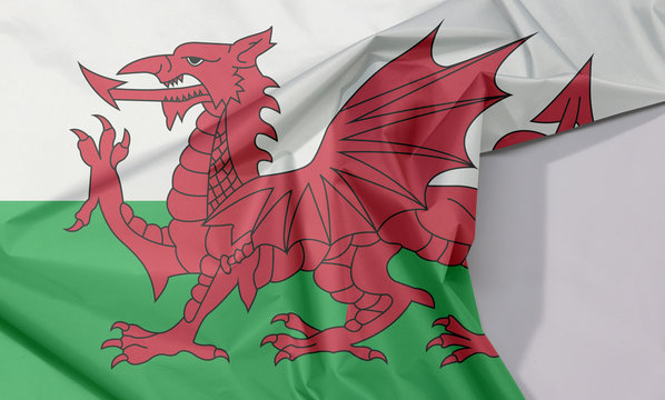 Wales fabric flag crepe and crease with white space, consists of a red dragon passant on a green and white field.
