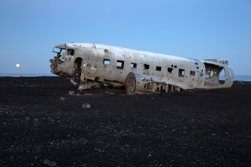 Iceland Plane Wreck accident on a black sand beach at dusk