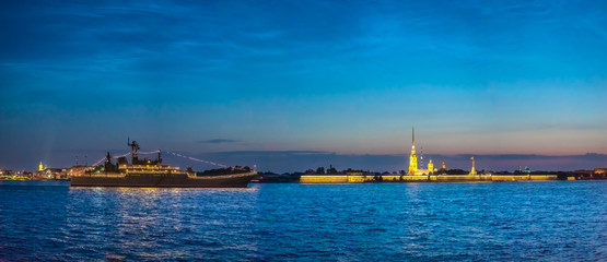 Fototapeta premium Saint Petersburg. Panorama of night Petersburg. Peter-Pavel's Fortress. Warships on the Neva River. Panorama of the Peter and Paul Fortress. Russia. White nights in Petersburg.