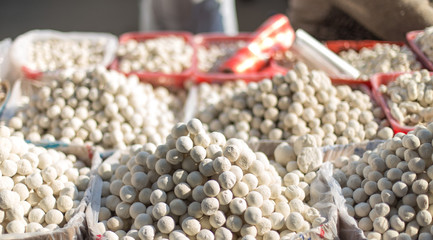Kazakh national kurt, round, salted curd on the market