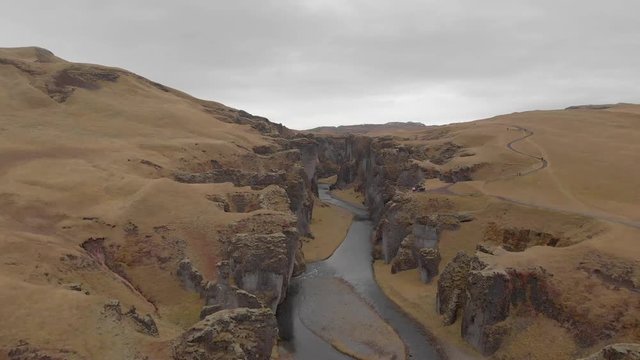 Cinematic aerial flyover of stunning Icelandic canyon.
