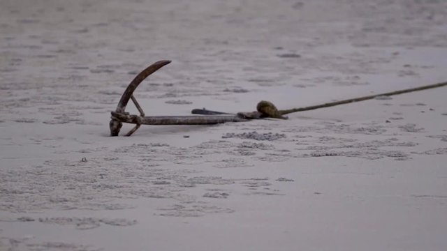 Anchor in the Sea Sand Waiting for High Tide to Reach Boat in Vilankulos, Mozambique