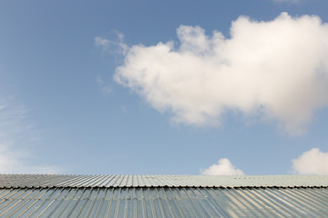 Beautiful blue cloud over the roof of the house