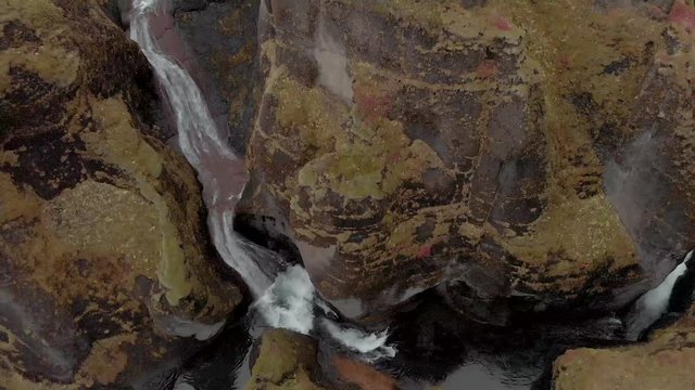 Cinematic aerial flyover of stunning Icelandic canyon.