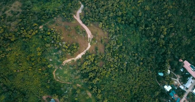 Aerial - drone flying over hill with a trail. Mt. Tapyas, Coron, Palawan, Philippines.