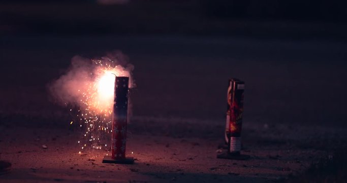 Small Firework Launched from Ground as Burned Debris Falls Down