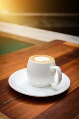 Cup of coffee hot latte on wood table