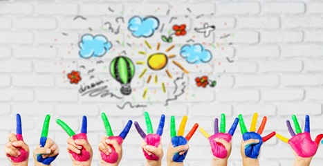 Image of human hands in colorful paint