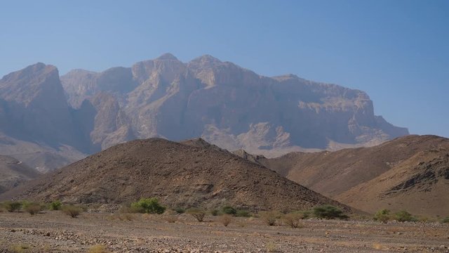 Steady driving shot while approaching the Jebel Shams mountains in the Sultanate of Oman.