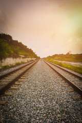 Fototapeta premium Railroad tracks in the setting sun