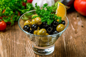 Kalamata olives on wooden table