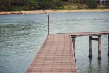 The wooden bridge in the sea