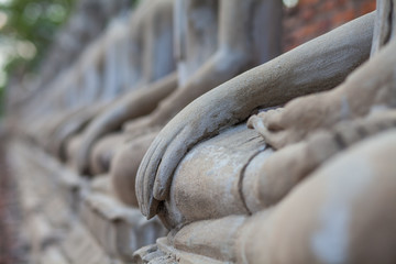 The Buddha laid hands on the lap.
