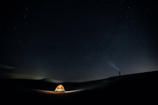 Person Stargazing While Camping