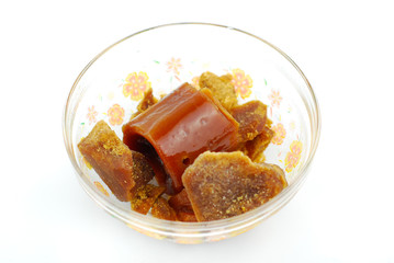 Palm sugar on white background