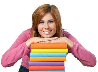 Redheaded female with her arms on a stack of textbooks