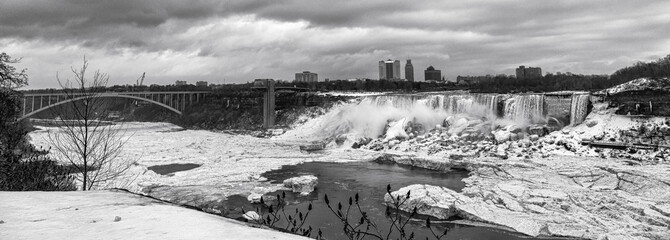 Black and white image dowriver of Niagara Falls frozen in winter