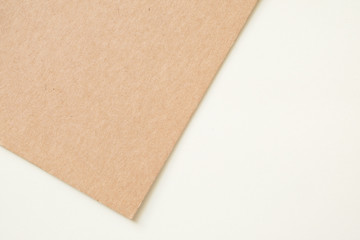 Fototapeta premium Kraft paper sheet overlap with brown and white colors for background, banner, presentation template.