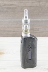 E - cigarette for vaping , technical devices.The liquid in the bottle   