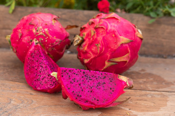 purple dragon fruit on table wood on nature background
