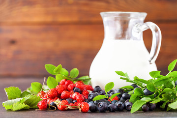 Forest berries and milk. Selective focus